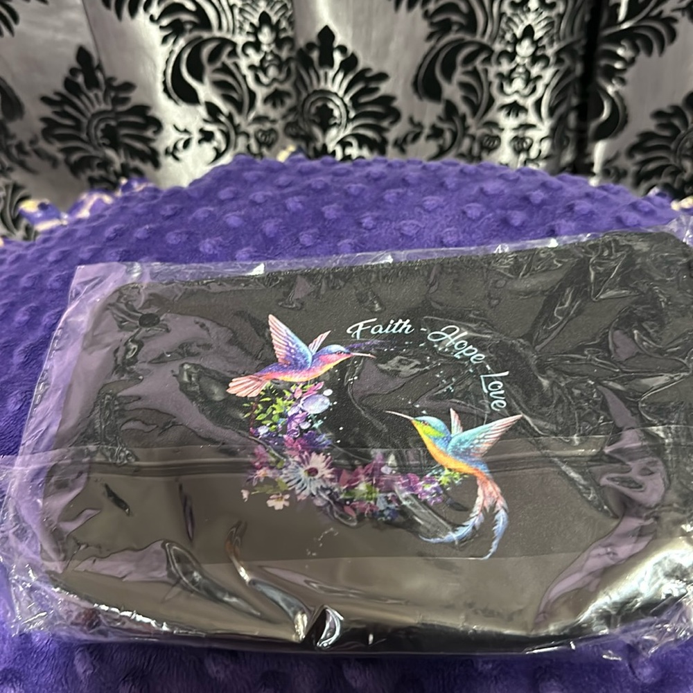Black makeup bag with hummingbird & flowers.